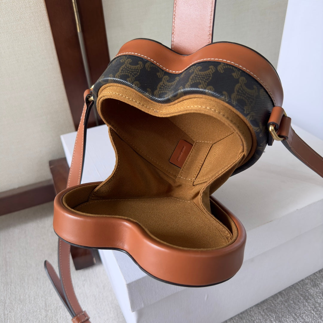 HEART TAMBOUR BAG 15 IN BLACK TRIOMPHE CANVAS AND BRONZE BROWN CALFSKIN