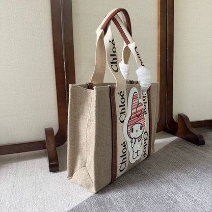 MY MELODY MEDIUM WOODY TOTE BAG 37 IN NATURAL FIBERS BEIGE WEBBING BROWN CALFSKIN