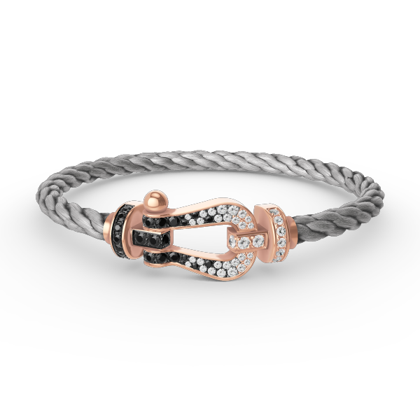 [AURORA]FORCE GROSSES HUFEISENARMBAND MIT SCHWARZ-WEISSEN DIAMANTEN UND ROSÉGOLD