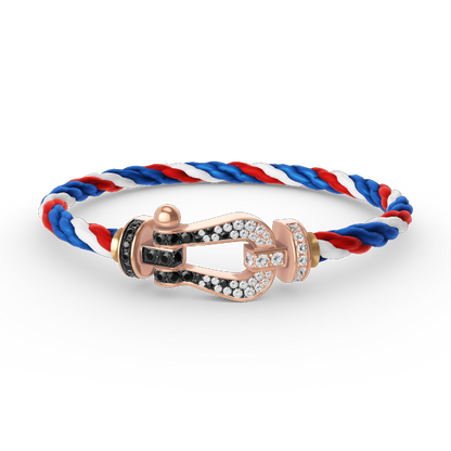 [AURORA]FORCE GROSSES HUFEISENARMBAND MIT SCHWARZ-WEISSEN DIAMANTEN UND ROSÉGOLD