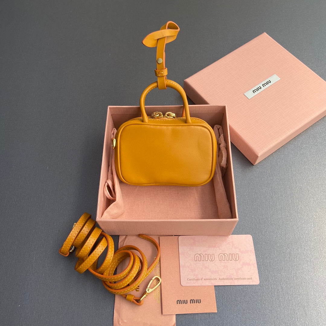 MICRO BAG KEYCHAIN 11  IN INDOCHINE ORANGE CALFSKIN EMBOSSED LOGO